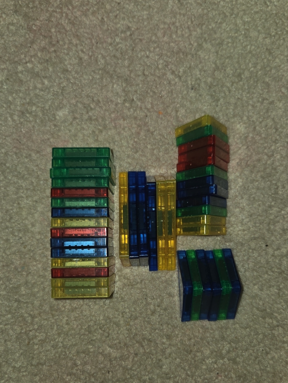 Source Unknown Transparent Magnetic Building Tiles in Blue, Green, Yellow, Red